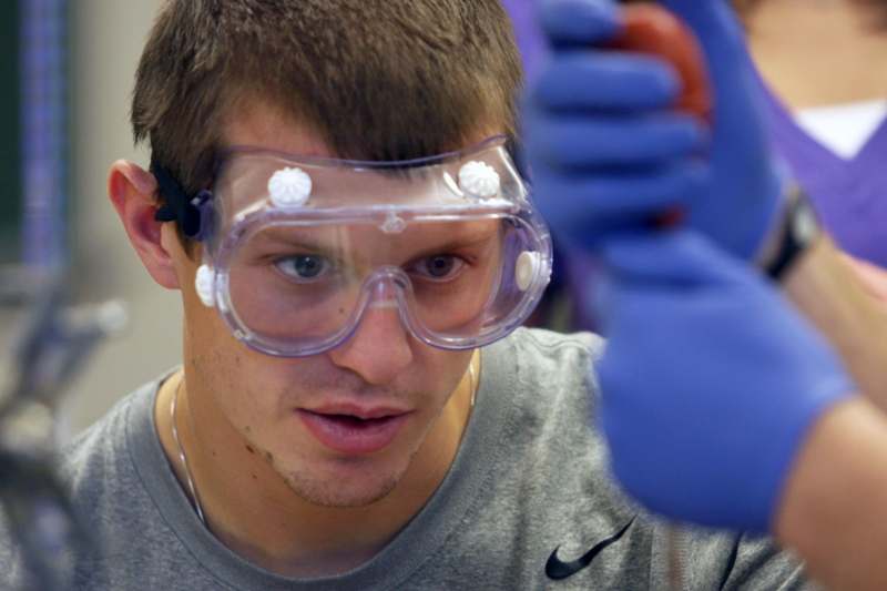 a man wearing goggles and gloves