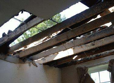 a damaged roof of a house