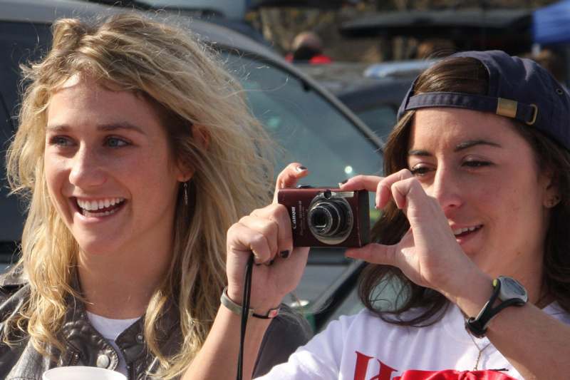 a couple of women taking a picture