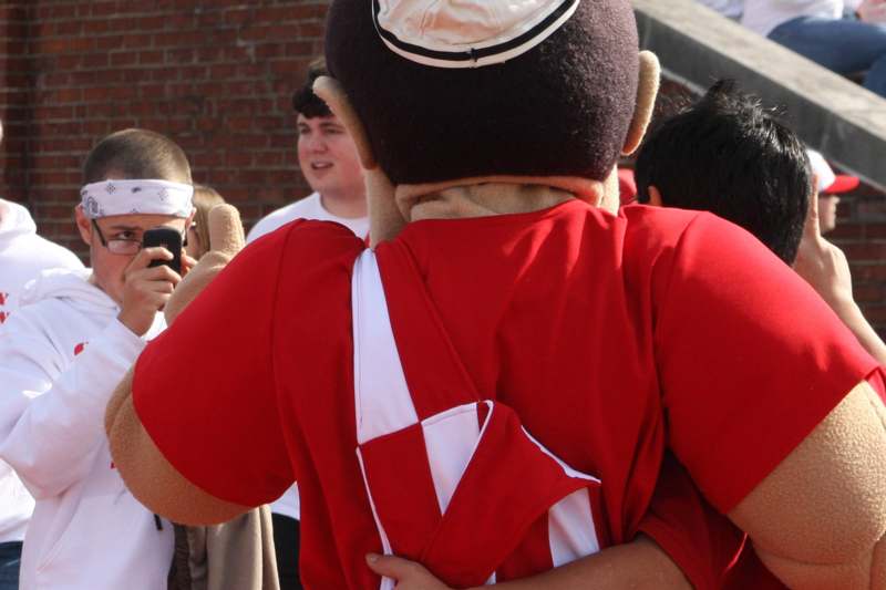 a person hugging another person
