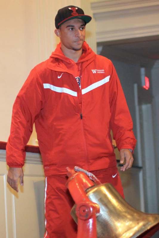 a man in a red tracksuit