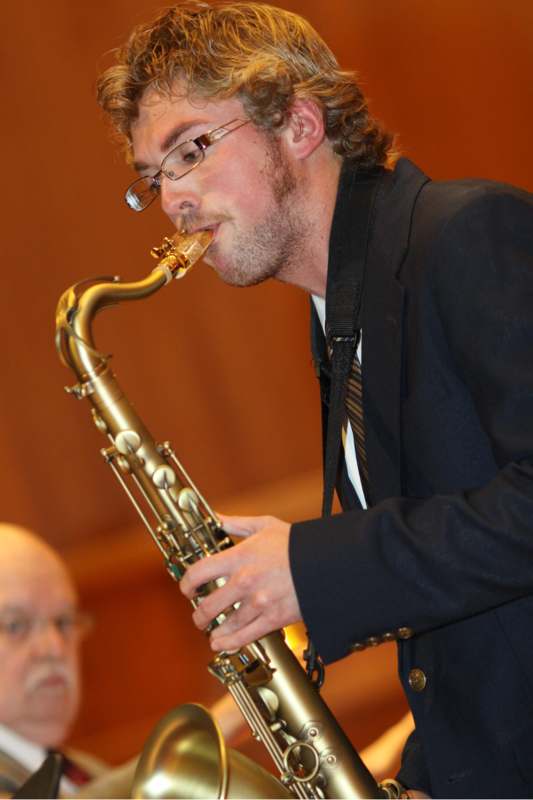 a man playing a saxophone