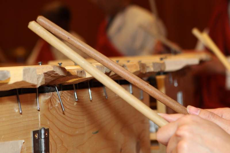 a person playing drums with nails
