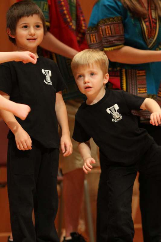 a group of kids in black shirts