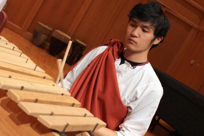 a man playing a xylophone