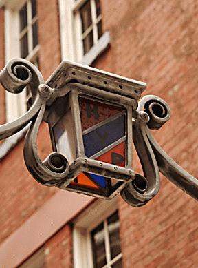 a street light with a colorful glass