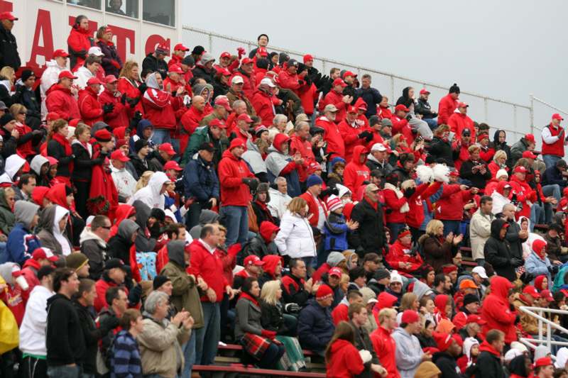 a crowd of people in red and white