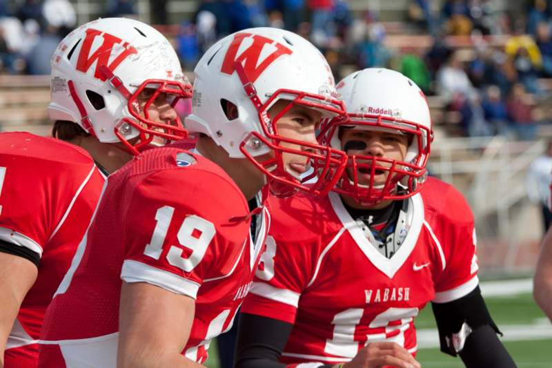 a group of football players in red uniforms