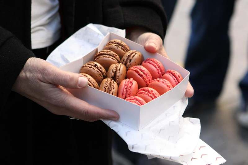 a box of cookies in a person's hands