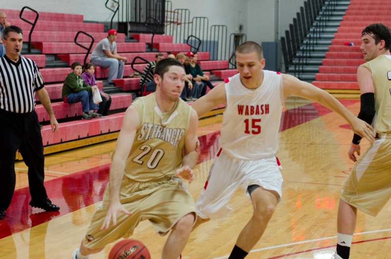 a group of men playing basketball