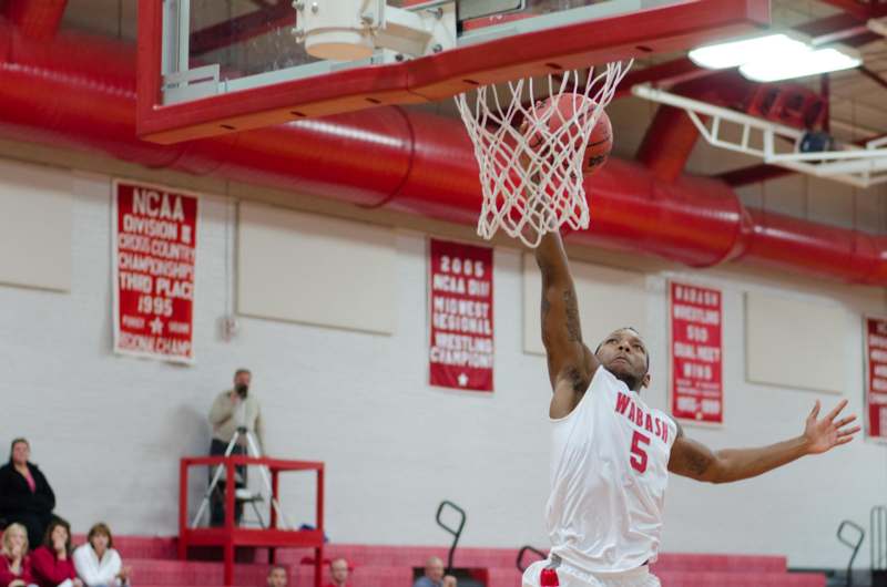 a man dunking a basketball