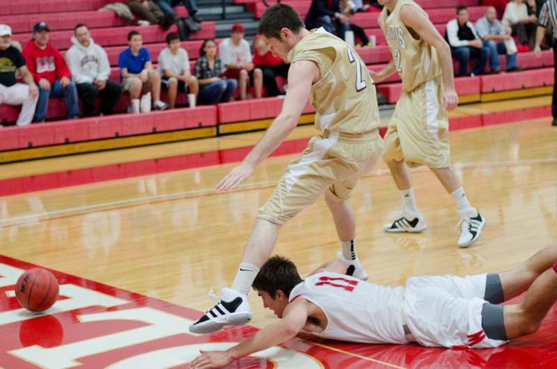 a group of men playing basketball