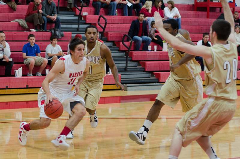 a group of men playing basketball
