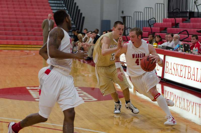 a group of men playing basketball