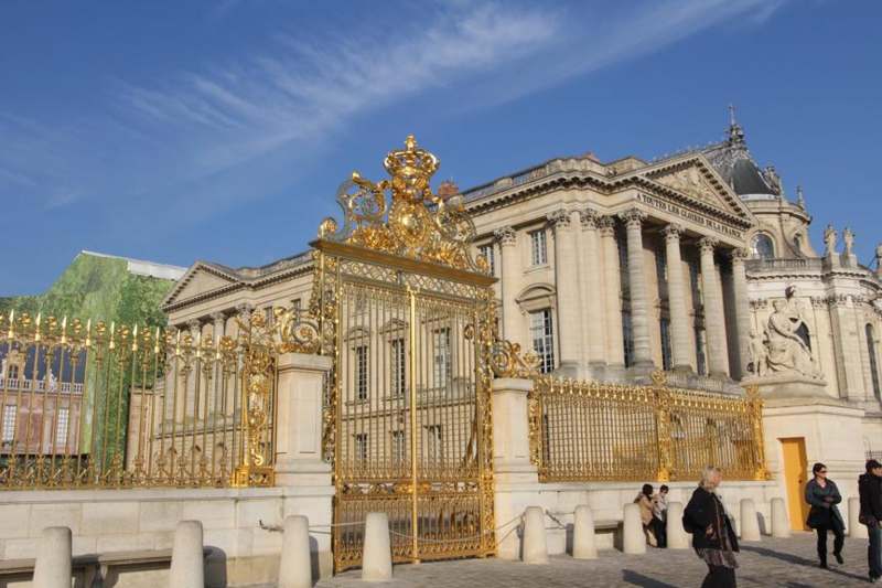 a large building with a gold gate