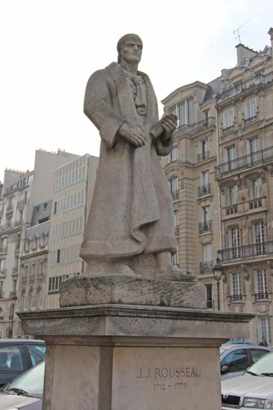 a statue of a man in a coat