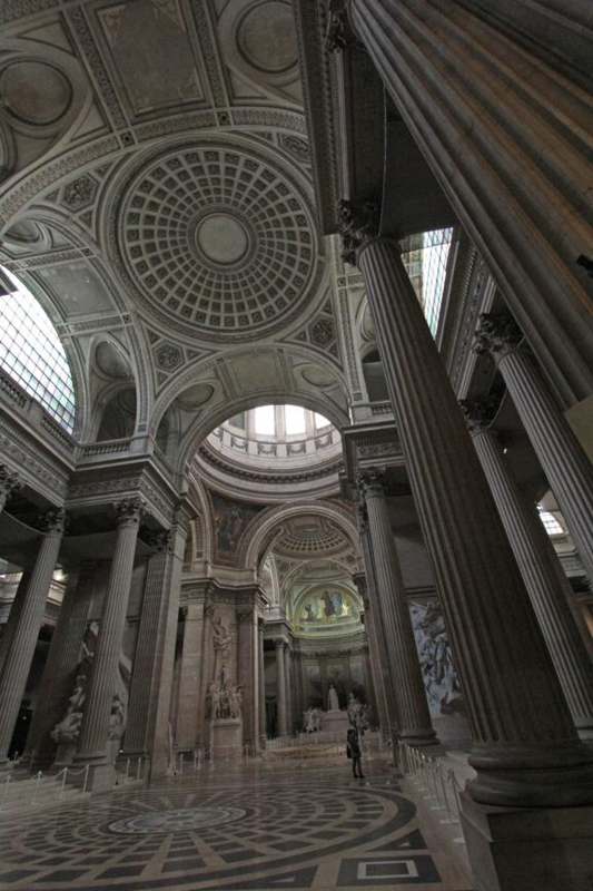 a large domed building with columns