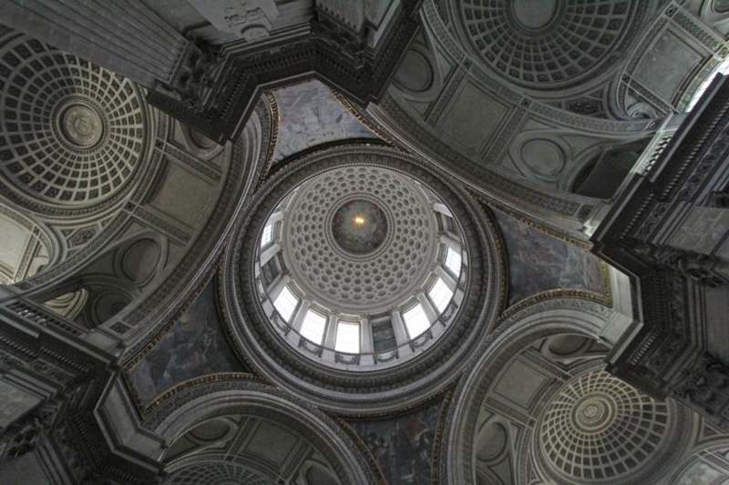a ceiling of a building with many round ceilings