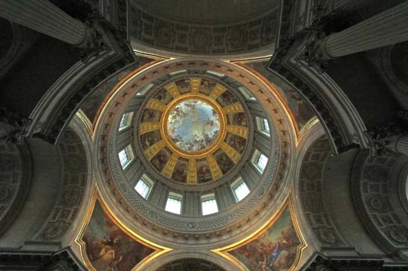 a ceiling of a building with a painted dome