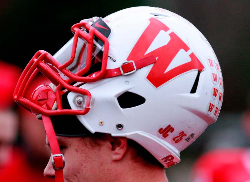 a football helmet with red and white letters