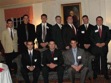 a group of men posing for a photo