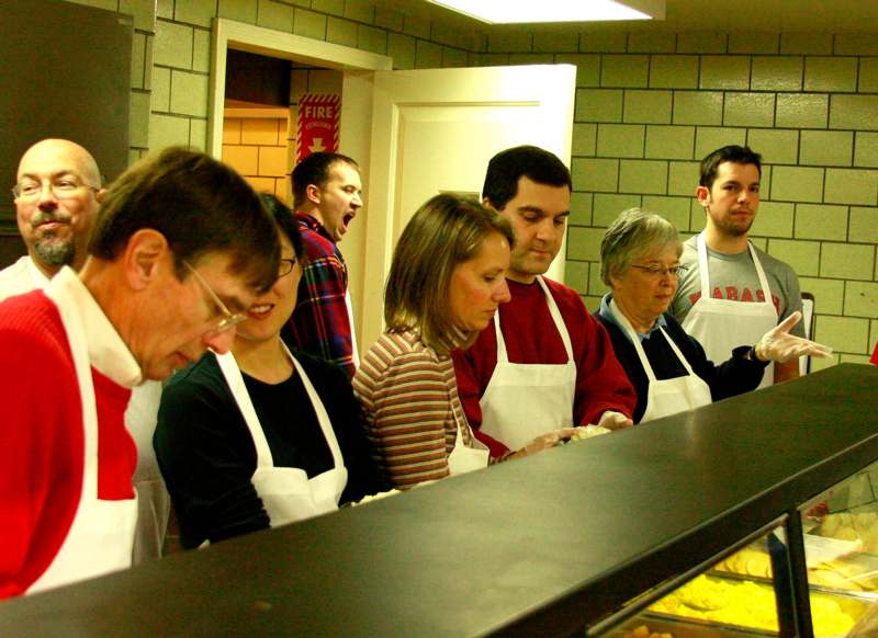 a group of people in aprons