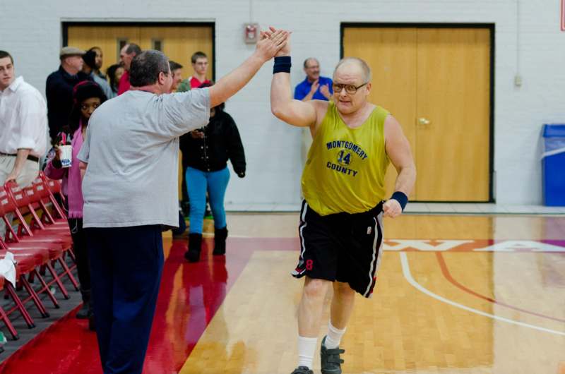 a man giving a high five to another man