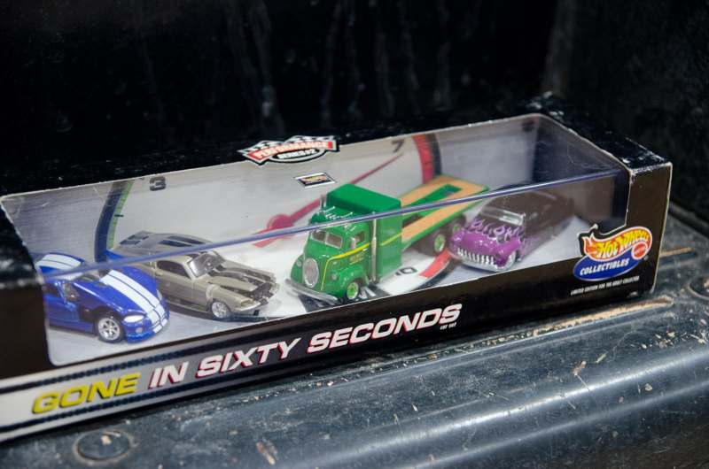 a group of toy cars in a box