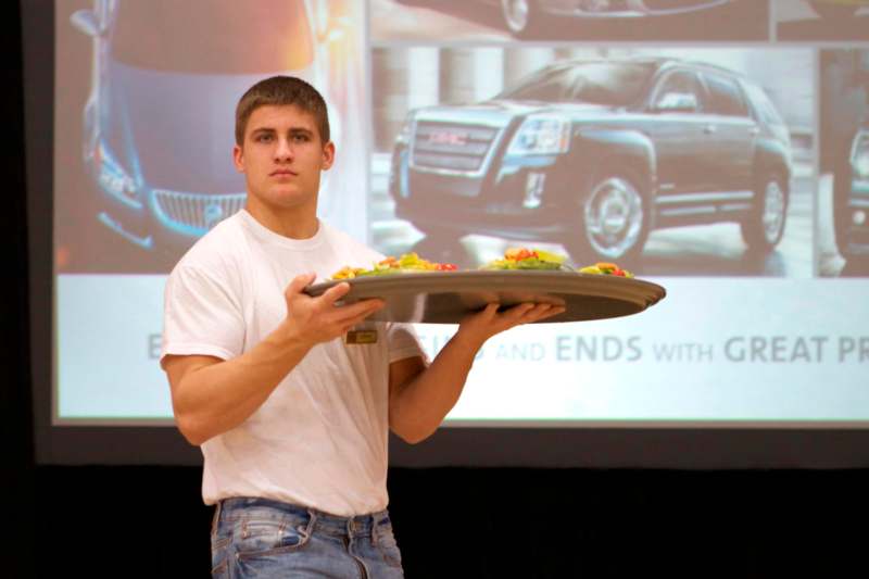 a man holding a tray of food