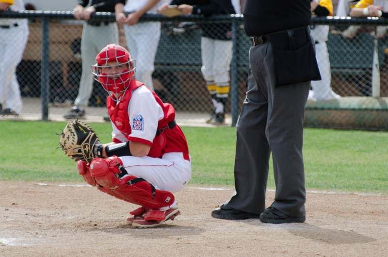 a baseball player in a catcher's position