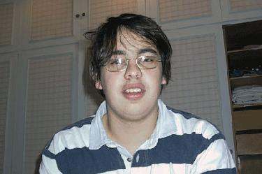 a young man wearing glasses