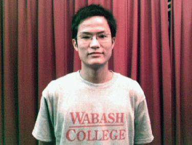 a man wearing glasses and a t-shirt