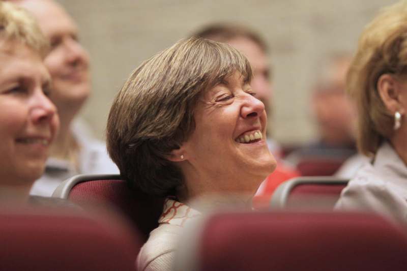 a woman laughing in a room