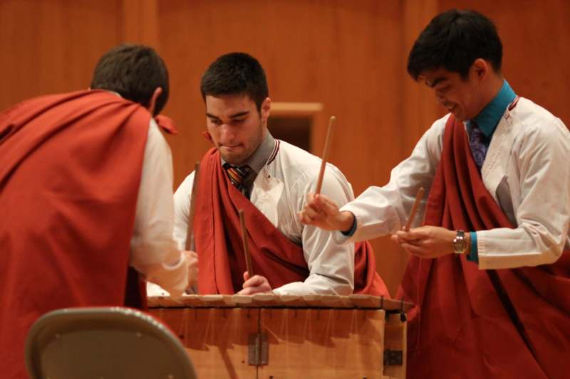 a group of men playing xylophone
