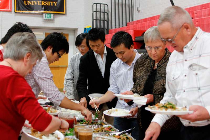 a group of people serving food