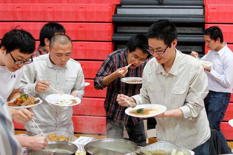 a group of men eating food