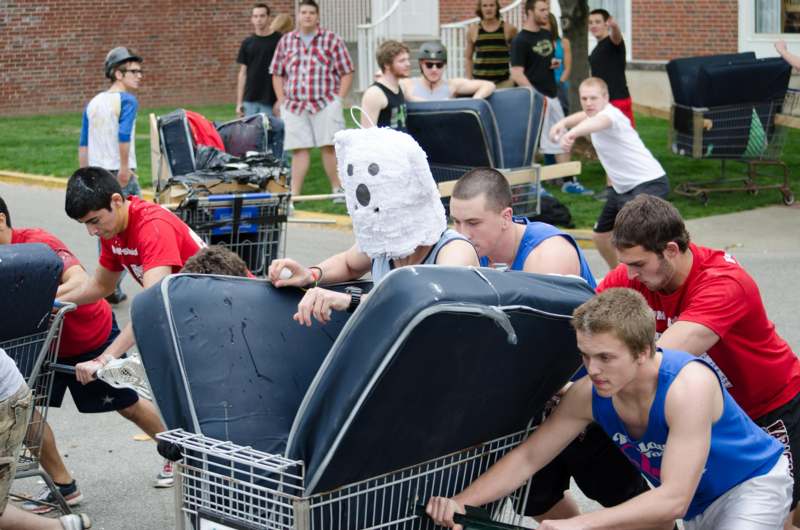 a group of people riding in shopping carts