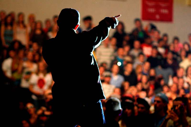 a man pointing at a crowd