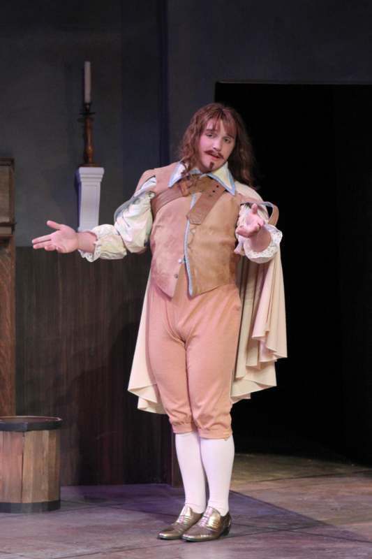 a man in garment on stage