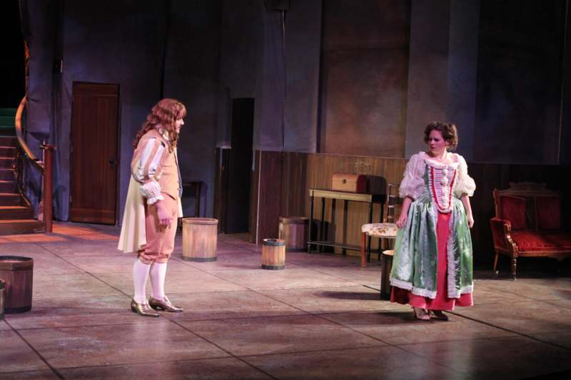 a man and woman on a stage