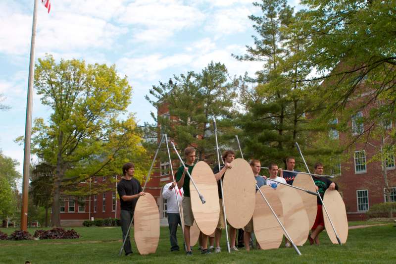 a group of people holding shields