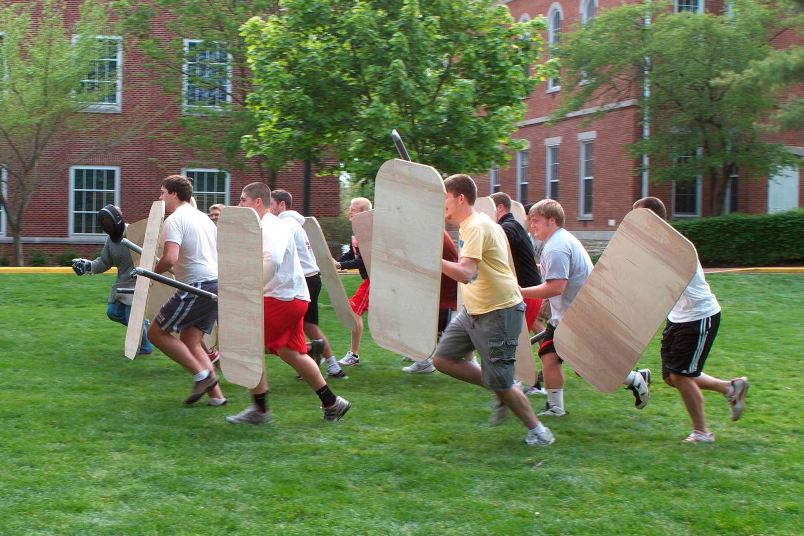a group of people holding shields
