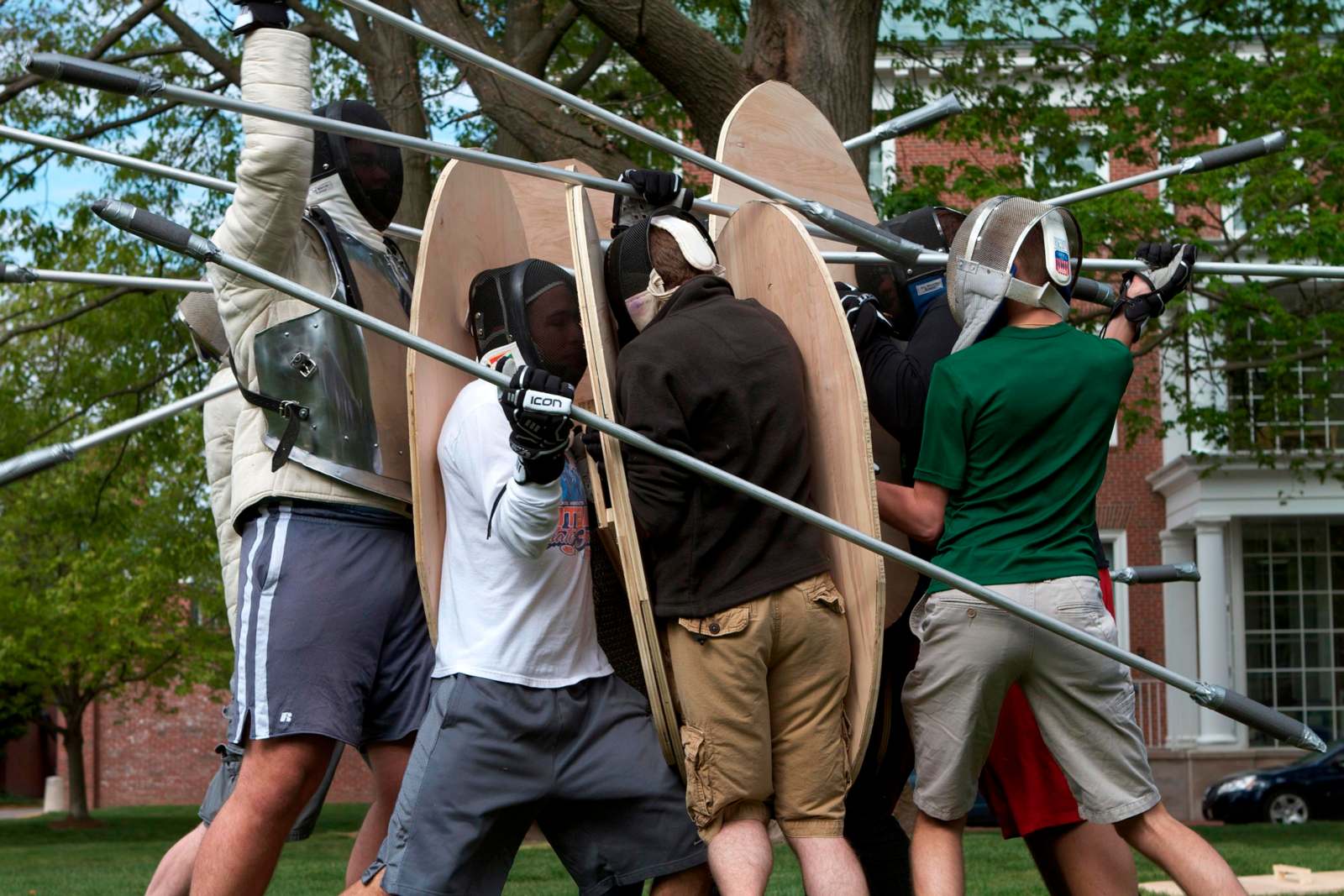 a group of people wearing helmets and shields