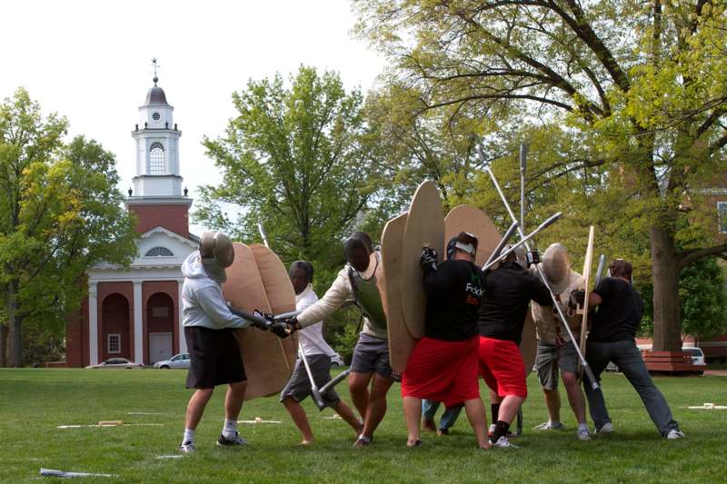 a group of people wearing shields and shields