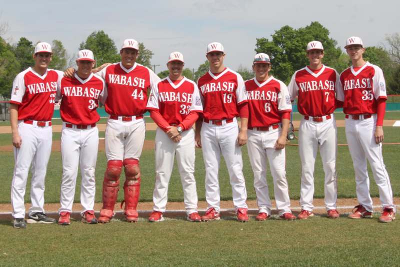 a group of baseball players posing for a photo