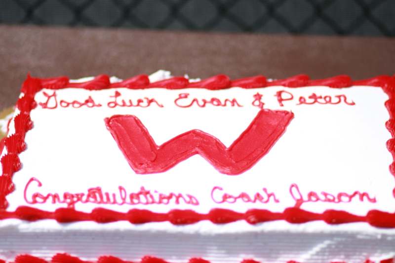 a cake with red frosting