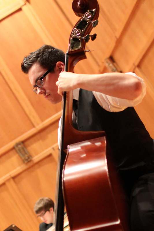 a man playing a cello