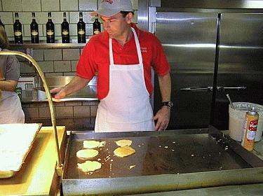 a man cooking in a kitchen