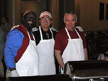 a group of men wearing aprons