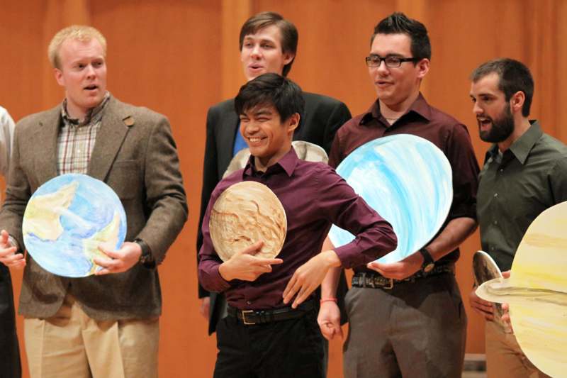 a group of men holding plates